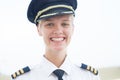 Happy pilot working at the airport, portrait. Transportation industry people Royalty Free Stock Photo