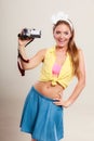 Happy pin up girl woman filming with camcorder. Royalty Free Stock Photo