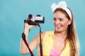 Happy pin up girl woman filming with camcorder. Royalty Free Stock Photo