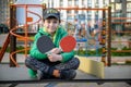 Happy ping pong player think about a game. young boy sitting aft Royalty Free Stock Photo