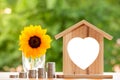 Happy Pink Piggy Bank and Home wooden in close-up and coins stack in the nature background, Saving ideas and investment budget, B Royalty Free Stock Photo