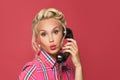 Happy pinup woman phone. Beautiful retro model girl with red lips makeup and vintage old-fashion hairstyle