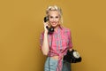 Happy Pinup woman with retro phone on yellow Royalty Free Stock Photo