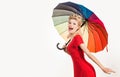 Happy pinup woman with umbrella at rainy weather. Rain rainbow autumn mood, pin up girl in red dress isolated white.