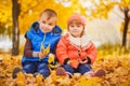 Happy playful children in the autumn park Royalty Free Stock Photo