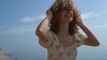 Happy girl jumping sea water in straw hat summer day close up. Woman have fun. Royalty Free Stock Photo