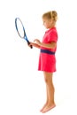 A little girl holds a tennis racket in her hands. Game, sports concept. Royalty Free Stock Photo