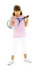 A little girl holds a tennis racket in her hands. Game, sports concept. Royalty Free Stock Photo