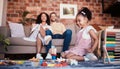 Happy, playing and a child with building blocks and parents for relax, education and learning in a house. Smile, playful Royalty Free Stock Photo