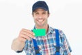Happy plumber showing green card