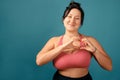 Happy plus size positive woman. Happy body positive concept. I love my body. Attractive overweight woman posing on camera in the Royalty Free Stock Photo