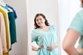Happy plus size woman posing at home mirror Royalty Free Stock Photo