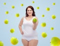 Happy plus size woman in underwear with apple Royalty Free Stock Photo