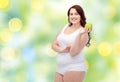 Happy plus size woman in underwear with apple Royalty Free Stock Photo