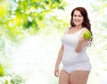 Happy plus size woman in underwear with apple Royalty Free Stock Photo