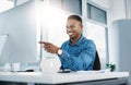 Happy, pointing and black man by computer in office, workspace and desk confident in creative career. professional Royalty Free Stock Photo