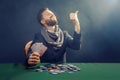 Happy poker player winning and holding a pair of aces Royalty Free Stock Photo