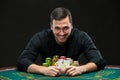 Happy poker player winning and holding a pair of aces Royalty Free Stock Photo