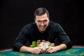 Happy poker player winning and holding a pair of aces Royalty Free Stock Photo