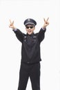 Happy Police Officer Giving Peace Sign and Wearing Sunglasses, Studio Shot