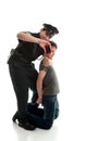 Happy policeman with apprehended teen boy Royalty Free Stock Photo