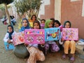 Happy poor muslim girls in veil received presents and gifts in Egypt Royalty Free Stock Photo