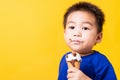 Kid cute little boy attractive laugh smile playing holds and eating sweet chocolate ice cream waffle cone Royalty Free Stock Photo
