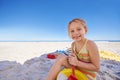 Happy, portrait and little girl with beach toys for playful holiday, summer vacation or outdoor weekend. Female person Royalty Free Stock Photo