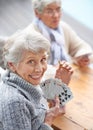 Happy, portrait and old people playing cards at a nursing home for happiness, recreation and game. Smile, showing and a Royalty Free Stock Photo