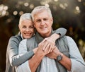 Happy, portrait and senior couple hug at a park, free and enjoy travel, holiday or weekend outdoor. Face, smile and