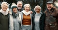 Happy, portrait and senior friends in a park while walking outdoor for fresh air together. Diversity, smile and group of Royalty Free Stock Photo