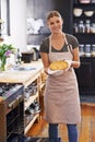 Happy, portrait and woman in bakery with a pie from cooking as a chef in kitchen at restaurant. Person, smile and food Royalty Free Stock Photo