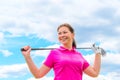 Happy portrait of a woman golfer with golf club Royalty Free Stock Photo
