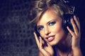 Happy, portrait and woman with headphones for music, streaming and listening to radio in dark. Techno, sound and face of Royalty Free Stock Photo