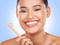 Happy portrait, woman and toothbrush on blue background for dental cleaning, gingivitis and beauty in studio. Model Royalty Free Stock Photo