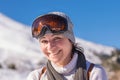 Happy portrait of a woman wearing ski sunglasses. Royalty Free Stock Photo