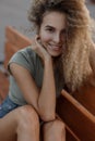 Happy portrait of a young funny curly girl outdoors Royalty Free Stock Photo
