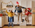 Happy ethnic family dad and children brother and sister have fun on Christmas day at home Royalty Free Stock Photo
