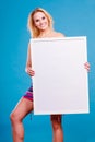 Happy positive blonde woman holding blank white board Royalty Free Stock Photo
