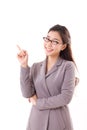 Happy, positive business woman pointing up Royalty Free Stock Photo