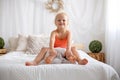 Happy positive children, tickling on the feet, having fun together, boy and girl at home having wonderful day of joy Royalty Free Stock Photo