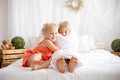 Happy positive children, tickling on the feet, having fun together, boy and girl at home having wonderful day of joy Royalty Free Stock Photo