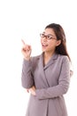 Happy, positive female business executive, business woman pointing up