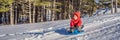 happy and positive little boy enjoying sledding and cold weather outdoor, winter fun activity concept BANNER, LONG Royalty Free Stock Photo