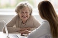 Happy positive older patient visiting geriatrician, consulting doctor Royalty Free Stock Photo