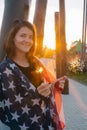 happy smiling young woman with sparklers and USA flag portrait at the sunset in park Royalty Free Stock Photo