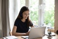 Happy positive student girl in headphones attending online learning conference Royalty Free Stock Photo