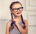 Happy positive thinking kid girl in fashion glasses with excited Royalty Free Stock Photo