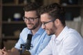 Happy positive young adult twin brothers broadcasting on air Royalty Free Stock Photo