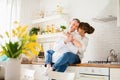 Happy positive young couple hugging in the kitchen Royalty Free Stock Photo